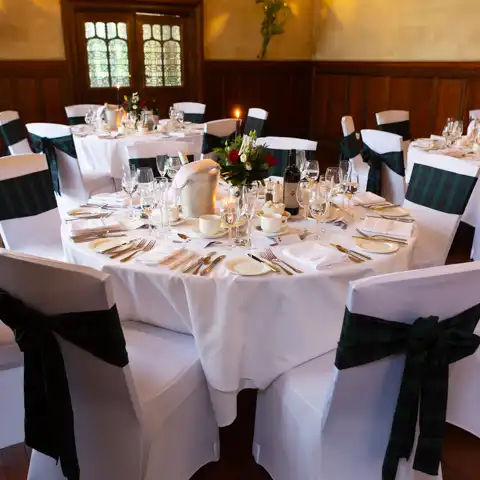 Wedding photo of the table layouts for the wedding breakfast at Fanhams Hall, Ware, Hertfordshire.  – photography by Glen Smith