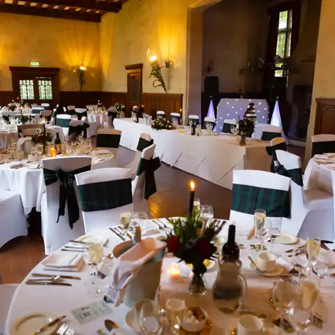 Wedding photo of the table layouts for the wedding breakfast at Fanhams Hall, Ware, Hertfordshire.  – photography by Glen Smith