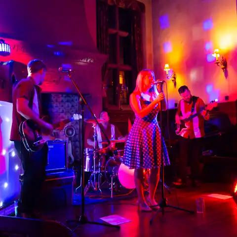 Wedding photo of the band, during the bride and groom's first dance at Fanhams Hall, Ware, Hertfordshire.  – photography by Glen Smith
